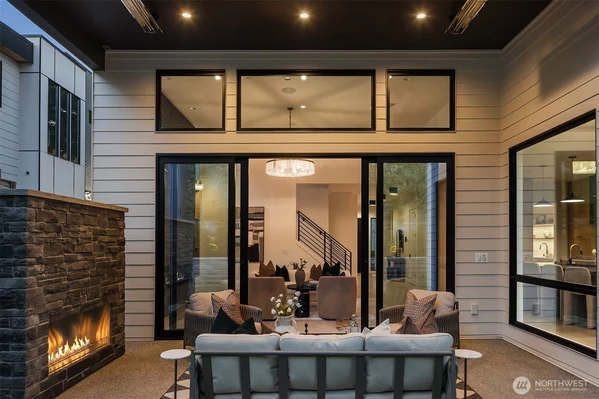 Outdoor living; heaters, gas fireplace, with an easy to maintain grass yard.